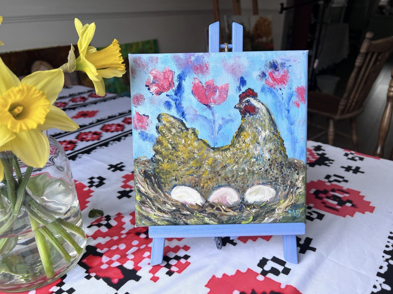 Hen in a Spring Garden by Marina Stognieva displayed in an interior